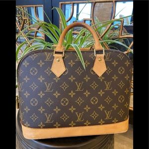 Elegant Louis Vuitton Alma bag